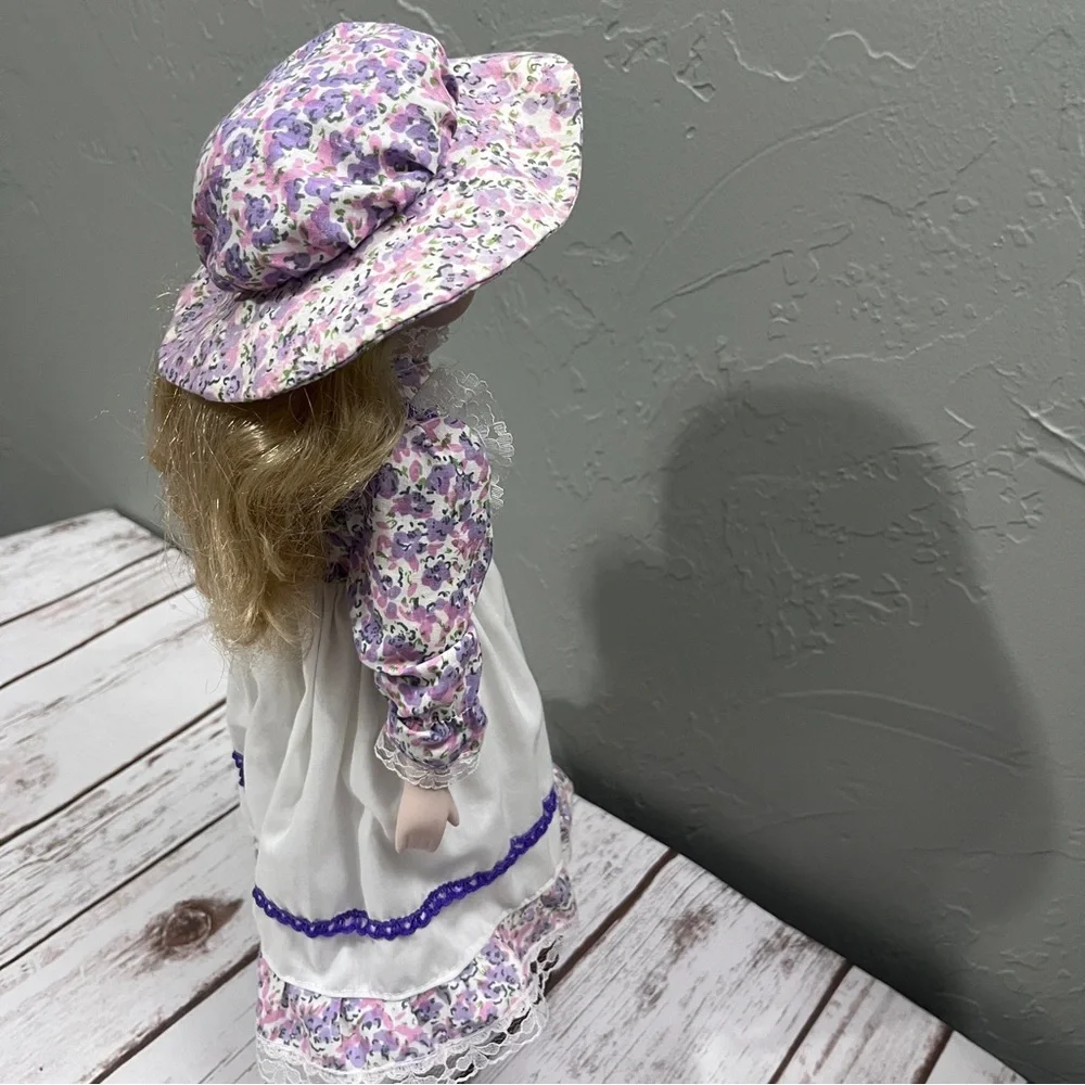Porcelain Doll with purple floral dress and‎ Hat vintage